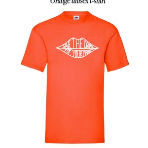 May include: Orange unisex t-shirt with a white graphic of a pair of lips with the text "Save the drama for your mama" inside.