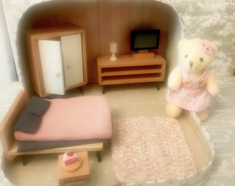 Travel doll house in suitcase with mouse