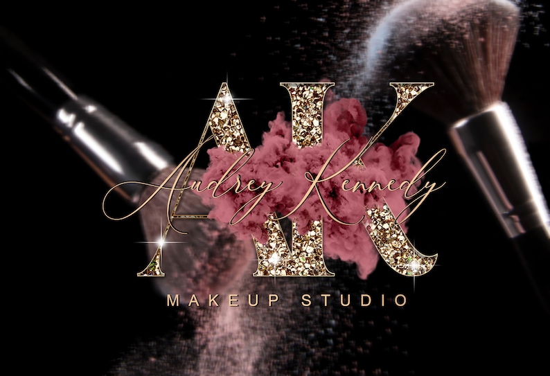 May include: Gold glitter letters "AK" with a pink and gold makeup powder cloud behind them. The text "Audrey Kennedy Makeup Studio" is below the letters.