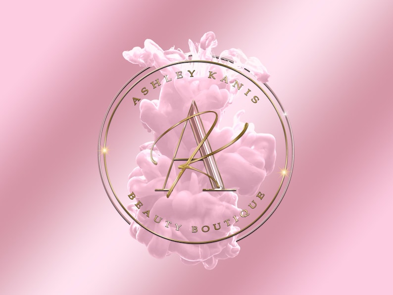 Może przedstawiać: Złote logo z tekstem "Ashley Kanis Beauty Boutique" w k&oacute;łku z r&oacute;żowym wzorem przypominającym chmurę w środku.