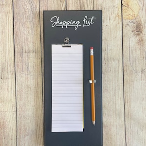 Customisable shopping list holder, slimline shopping list, tear off shopping list and and pencil holder