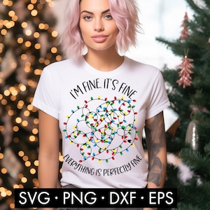 May include: White t-shirt with a Christmas lights design and the text "I'm fine. It's fine. Everything is perfectly fine."