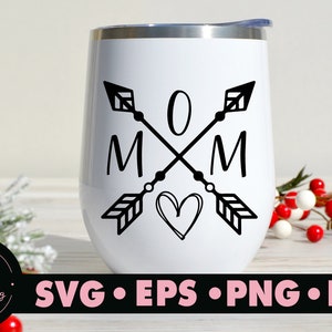 May include: White stainless steel tumbler with a black design of two arrows crossing with the word "MOM" and a heart in the center.