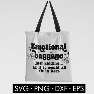 May include: White tote bag with black text that reads "Emotional baggage just kidding... as if it would all fit in here". The text is in a retro font style with a flower graphic on either side.