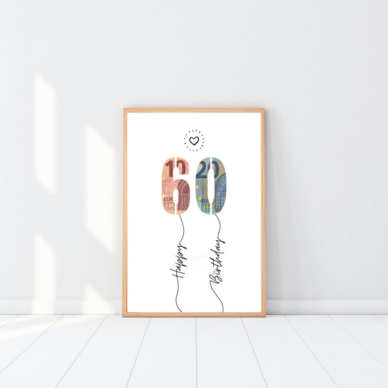 Könnte beinhalten: Ein weißer druckbarer Poster mit einem Herzen oben und der Zahl 60 aus Euro-Scheinen. Die Zahl 60 ist an zwei Schnüre befestigt, auf denen "Happy Birthday" steht.