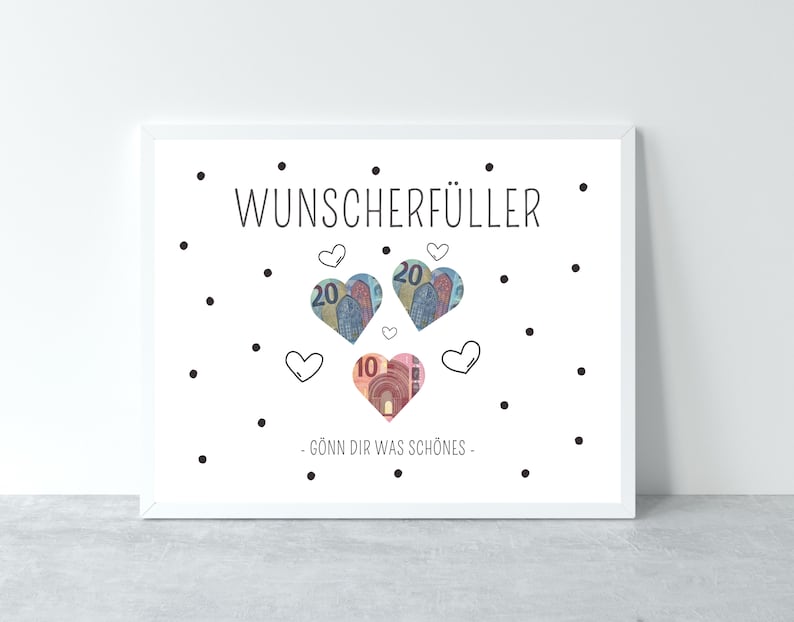 May include: A white framed print with the text "Wunsch erf&uuml;ller" in black. The print features a design of hearts made of euro bills with the text "G&ouml;nn dir was sch&ouml;nes" in black.