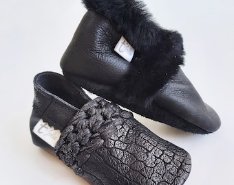 Black leather baby and children's slippers with or without customizable fur.