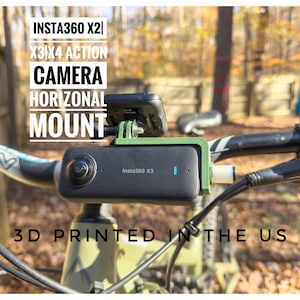 May include: A green 3D printed mount for an Insta360 X2 or X3 action camera, mounted horizontally on a bicycle handlebar. The text "INSTA360 X2| X3/X4 ACTION CAMERA HORIZONTAL MOUNT" and "3D PRINTED IN THE US" is visible on the image.