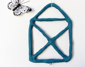 Wall hook in playful shapes made of papier-mâché for kids' room