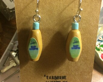 Novelty Earrings: Baby Shampoo (decorative). Do not immerse in water--label will probably peel off.