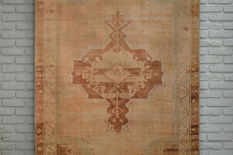 Antique Rug in beige, brown, earth tones