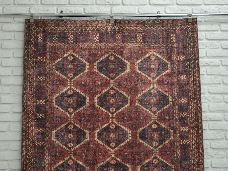 red afghan rug with geometric medallions