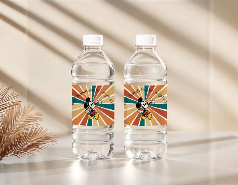 May include: Two clear plastic water bottles with white caps. Each bottle has a label featuring Mickey Mouse and the text "Sounds like we've got a party". The label has a retro color scheme of orange, teal, and brown.