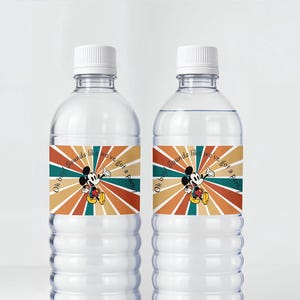 May include: Two clear plastic water bottles with white caps. Each bottle has a label featuring Mickey Mouse with the text "Oh boy! Sounds like we've got a party!" in a retro color scheme of orange, teal, and brown.