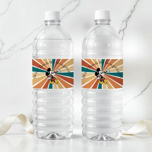 May include: Two clear plastic water bottles with white caps. Each bottle has a label featuring Mickey Mouse and the text "Oh boy sounds like we've got a party". The label has a retro color scheme of orange, teal, and brown.
