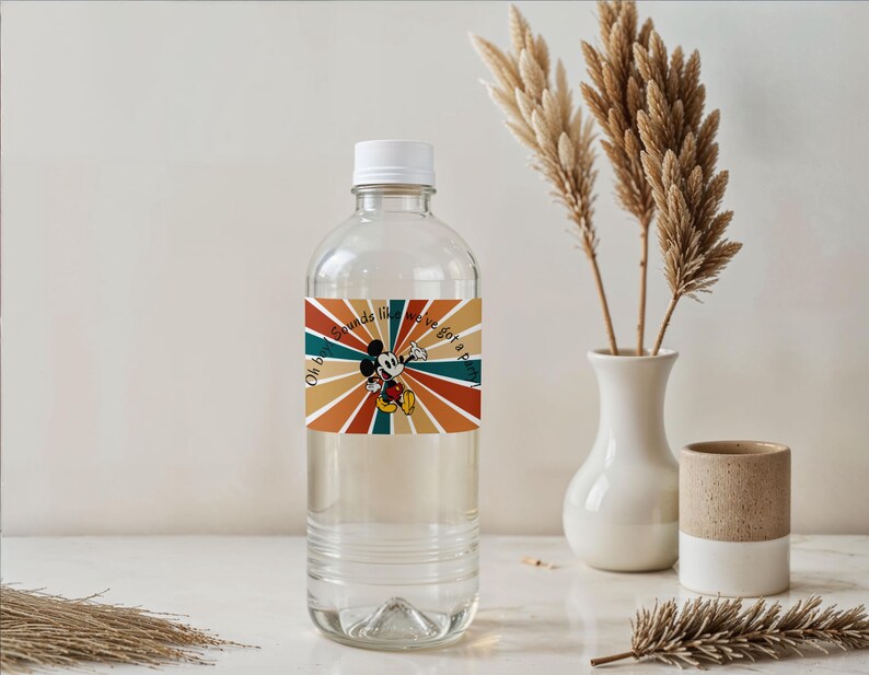 May include: A clear plastic water bottle with a white cap and a colorful label featuring Mickey Mouse and the text "Oh boy, Sounds like we've got a party". The label has a retro design with orange, brown, and teal stripes.