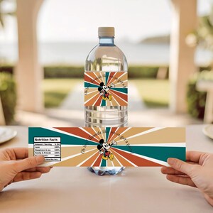 May include: A clear water bottle with a label featuring Mickey Mouse and the text "Oh boy sounds like we've got a party". The label has a retro design with orange, brown, and teal stripes. A second label is held below.