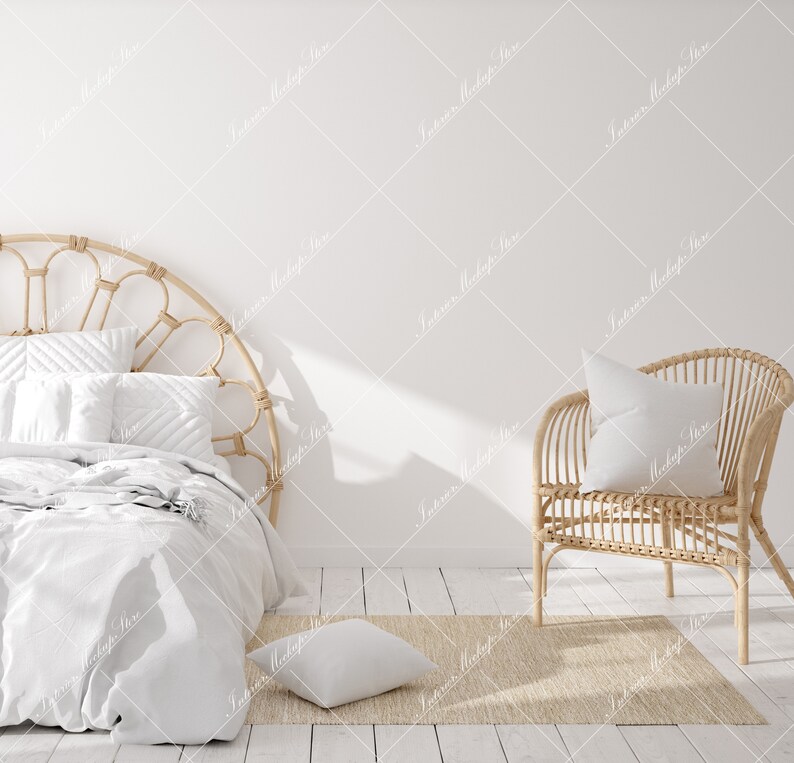 May include: A white bed with a woven headboard and a white blanket. A wicker chair with a white pillow sits on a beige rug in front of the bed.