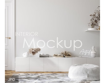 May include: A white interior design mockup with a white cabinet, a white ottoman, a white vase with dried pampas grass, and a book on top of the cabinet. The text "Interior Mockup" is written in white on the wall.
