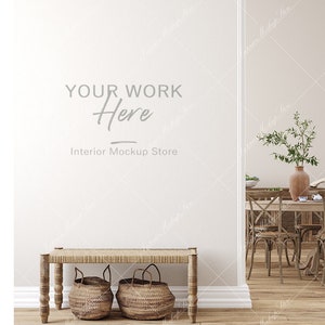May include: A white wall with the text "YOUR WORK Here Interior Mockup Store" in a light gray font. A wooden bench with a woven seat sits in front of the wall. Two woven baskets are on the floor in front of the bench. A dining room with a wooden table and chairs is visible in the background.