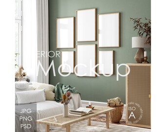 May include: A living room interior design mockup with a white sofa, a wooden coffee table, a wicker basket, and a cabinet with a woven front. There are five framed pictures on the wall, with a green wall behind them.