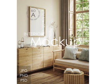 May include: A light wood cabinet with three doors and a light wood sofa with a light grey and white striped cushion and a light blue cushion. The cabinet is decorated with two glass candle holders and a white bowl. The sofa is in front of a window with a view of green trees. The text "INTERIOR MOCKUP" is written in white on a light brown background.