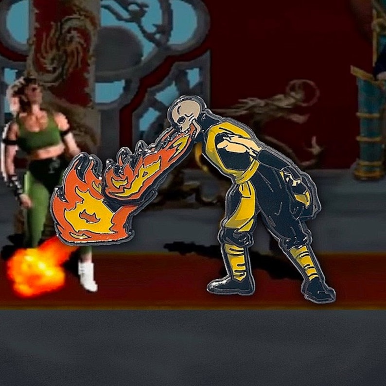 May include: A black and yellow enamel pin of a character from a video game. The character is breathing fire. The pin is a collectible for fans of the game.