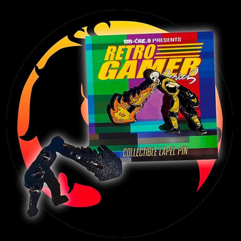 May include: A black and yellow enamel pin featuring a character from a video game. The character is holding a flaming object and is in a fighting pose. The pin is labeled "Retro Gamer Series" and "Collectible Lapel Pin".