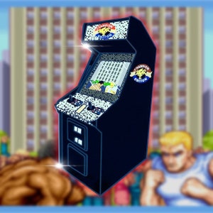 May include: A black arcade cabinet with a white and black speckled design. The cabinet has a screen showing a video game with two players. The cabinet has a "Champion Edition" logo on the top and side.