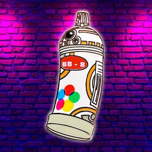 May include: A white spray paint can design with a BB-8 theme. The can features a red oval with "BB-8" in white text, and colorful circles. The can has brown, orange, and gray accents. The background is a purple brick wall.