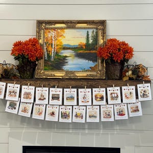May include: A decorated mantel featuring a framed landscape painting, orange floral arrangements, and a banner of small cards. The cards are held by clothespins and depict various autumn-themed illustrations.