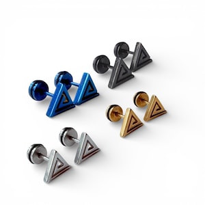 May include: A selection of geometric stud earrings in blue, black, gold, and silver. Each earring has a triangular design with an inner spiral pattern. The earrings have a post and backing closure. The earrings are suitable for pierced ears.