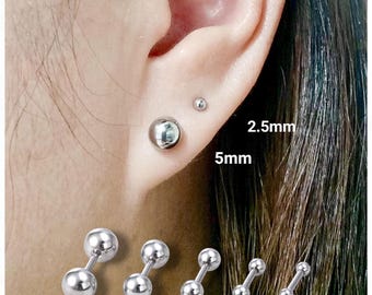 May include: A close-up of an ear with two silver ball stud earrings, 5mm and 2.5mm. Below, a display of silver barbell earrings in sizes 6mm, 5mm, 4mm, 3mm, and 2.5mm. The earrings are displayed against a white background.