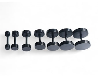 May include: A set of black stainless steel ear studs in various sizes. The studs are round and have a flat back.