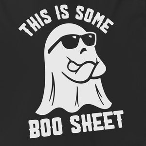 May include: A white ghost wearing sunglasses and sticking its tongue out. The ghost is saying "This is some boo sheet".