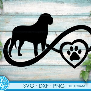 May include: Black silhouette of a dog with a paw print inside a heart shape, all within an infinity symbol. The design is on a light blue wood background.