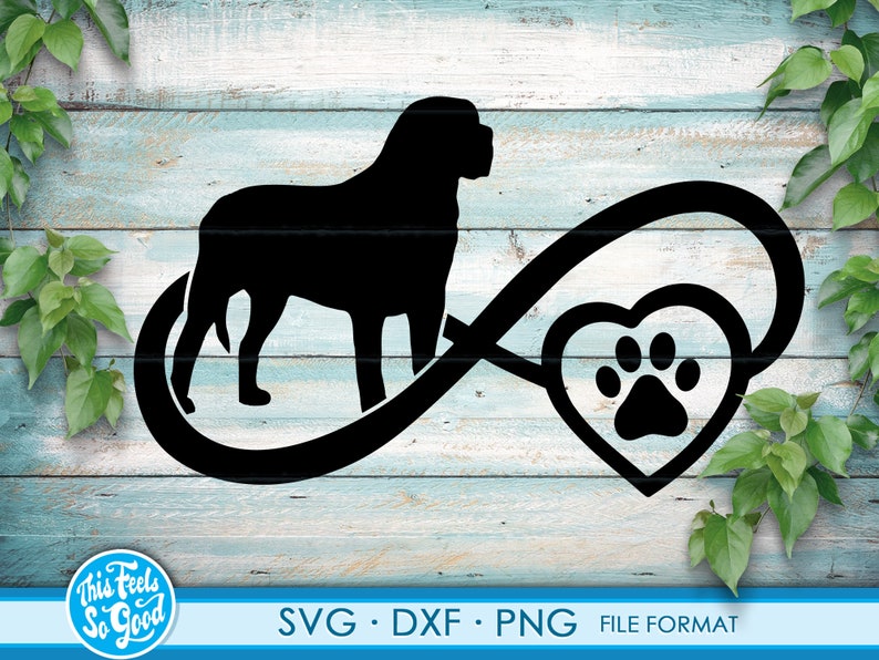 May include: Black silhouette of a dog with a paw print inside a heart shape, all within an infinity symbol. The design is on a light blue wood background.