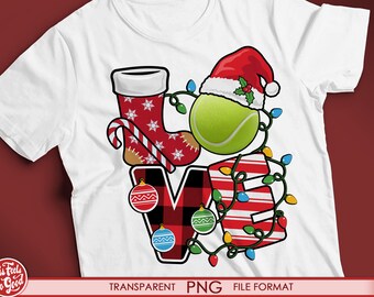 May include: A white t-shirt with a red and green Christmas-themed design featuring a stocking, a tennis ball, a Santa hat, and a candy cane. The design spells out the word "LOVE" with Christmas lights.