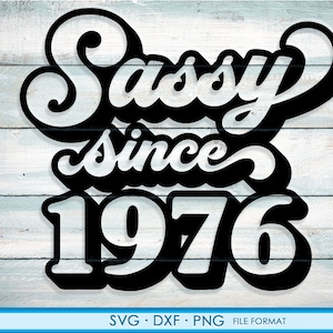 May include: Black and white graphic design with the text "Sassy since 1976" in a retro font style.