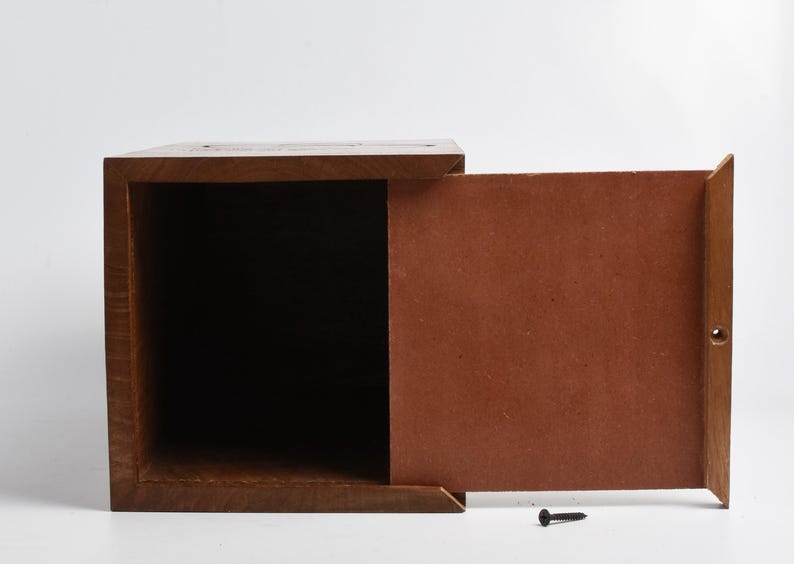 May include: A wooden box with a hinged lid. The box is open and the inside is empty. The box is made of dark wood and has a natural finish.