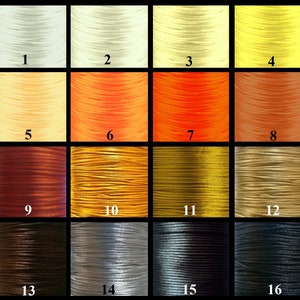 May include: A colour chart of 16 different colours of waxed cord. The colours are arranged in four rows of four. The colours are: white, cream, yellow, orange, peach, gold, brown, beige, dark brown, silver, grey, black, dark grey, and black.