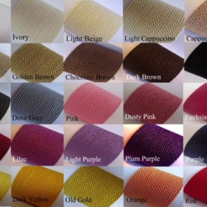 May include: Swatch card of 20 different colors of fabric. The fabric is a textured knit with a small, raised pattern. The colors are arranged in rows of four, with the names of each color printed below the swatch.