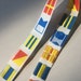 7/8" Nautical flags on white, woven Jacquard ribbon trim