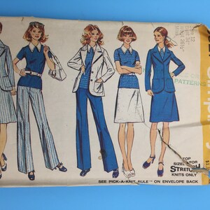 May include: Vintage Simplicity sewing pattern number 527 for a women's outfit. The pattern includes a skirt, pants, and a jacket. The pattern is for stretch knits only. The pattern is for sizes 12, 34 bust, 26 1/2 waist.