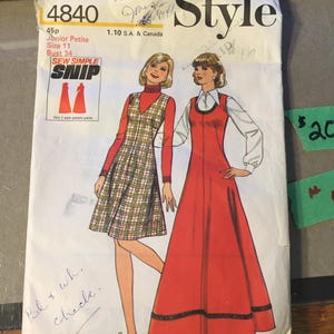 May include: Vintage sewing pattern titled "Style 4840" featuring illustrations of two women in dresses. The pattern includes sizes for Junior Petite, size 11, and a bust size of 86 cm. The cover is white with red and black accents.