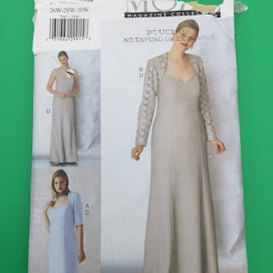 May include: A sewing pattern for a dress and jacket. The pattern is for sizes 14W to 30W. The pattern is for a dress with a sweetheart neckline and a jacket with a lace overlay. The pattern is from Vogue Magazine Collection.