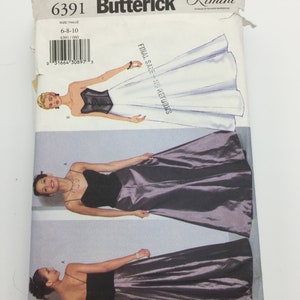 Può includere: Un cartamodello per un abito da sera con un corpetto aderente e una gonna fluida. Il cartamodello è per le taglie 6-8-10 ed è del marchio Butterick. Il cartamodello è etichettato "Final Sale - No Returns".