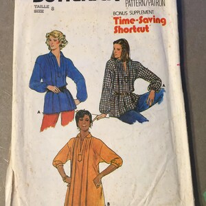 May include: Vintage Butterick sewing pattern featuring illustrations of three different tops. The pattern includes the text "Quick! Butterick," "Time-Saving Shortcut," and the size 8. The cover shows a blue top, a plaid top, and an orange top.