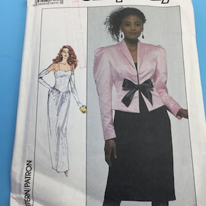 May include: Simplicity sewing pattern number 2991, size 12, for a pink blazer with a black bow and a black skirt.