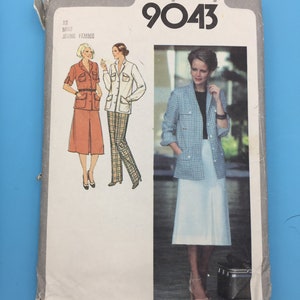 May include: Simplicity sewing pattern number 9043 for a women's jacket and skirt. The pattern includes three different looks, one with a plaid jacket and white skirt, one with a white jacket and plaid pants, and one with a solid red jacket and skirt. The pattern is for sizes 12 to 18.